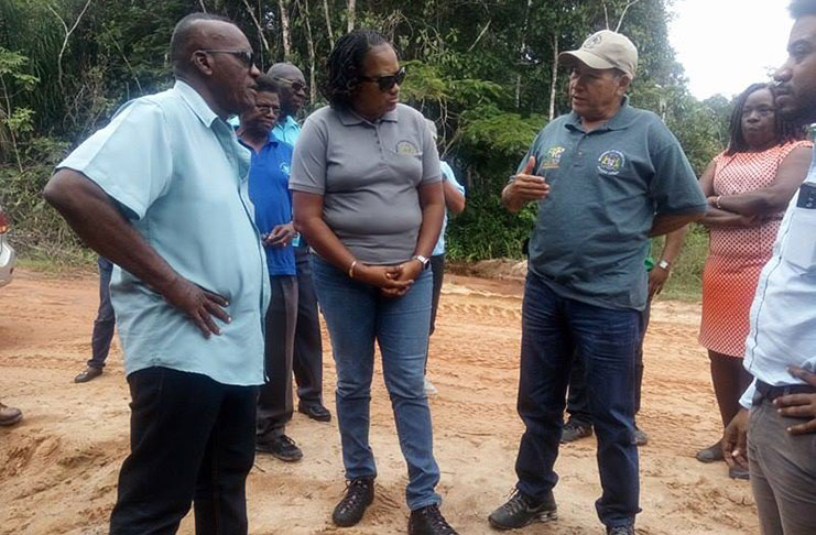 Minister of Public Infrastructure, Ms  Annette Ferguson, and Minister of Indigenous People's Affairs, Mr Sydney Allicock discussing with Region 10 Chairman, Mr Renis Morian,ways in which the two ministries and the RDC can collaborate on fixing the road
