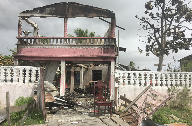 The  two-storey house in Number 59 Village, East Berbice/Corentyne, that was set ablaze by Vekanand Dhanraj on Friday