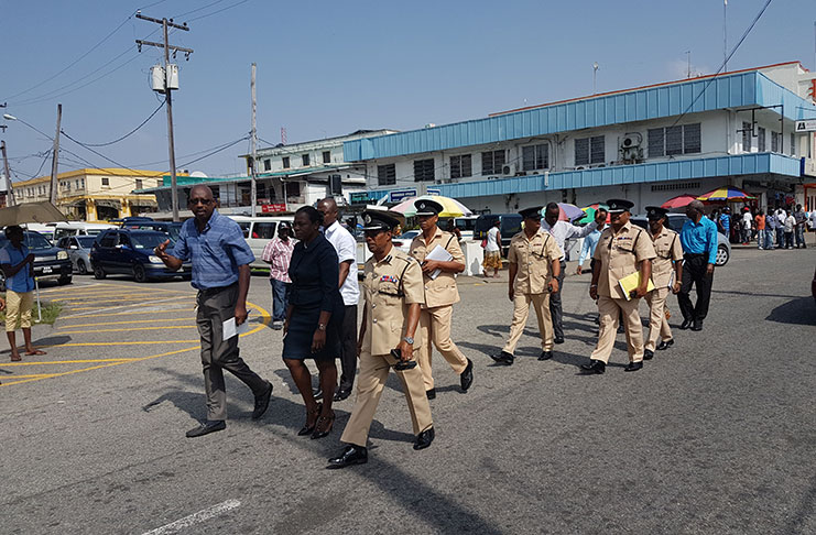 Minister Henry along with other Mash officials and members of the police force inspecting the Avenue of the Republic route.