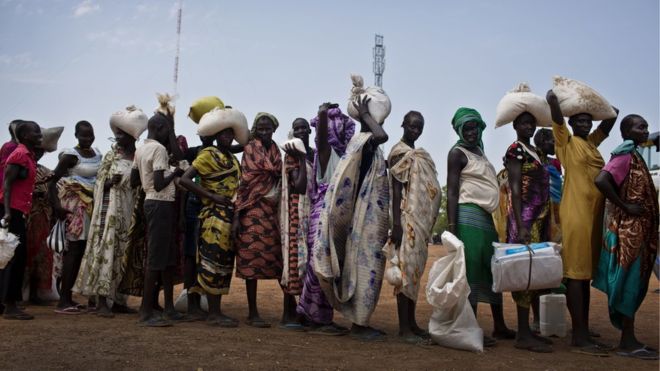 Queuing for food aid - civil war and economic collapse are being blamed