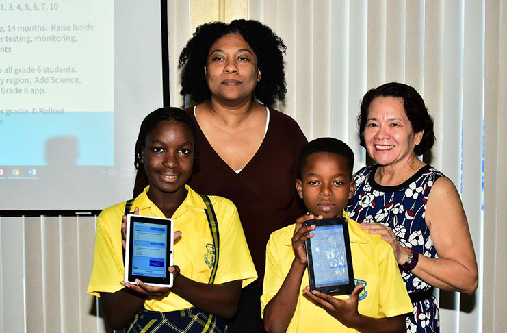 First Lady, Mrs Sandra Granger, poses with Ms. Karen Abrams and two Grade Six Students who attended the launch (MOTP photo)