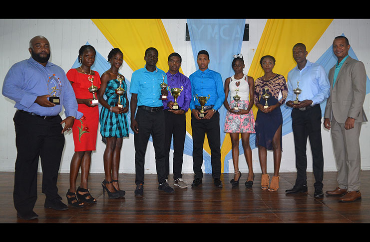 AAG president, Aubrey Hutson (right) and some of the awardees (from left): Coach of the Year, Johnny Greavesande, Youth Female of the Year runner-up, Kenisha Phillips, Youth Female of the Year, Chintoba Bright; Samuel Lynch, Youth Male of the Year, Daniel Williams, Junior Male of Year, Compton Caesar; Avon Samuels, Senior Female of the Year runner-up, Alita Moore; Senior Male Athlete of the Year, Rupert Perry