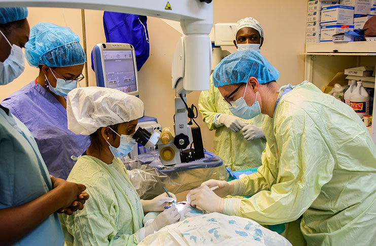 US Ophthalmologist, Dr. Aaron Smalley (right) and team of doctors during a cataract surgery at the GPHC – all part of the Ophthalmologist training in cataract surgery