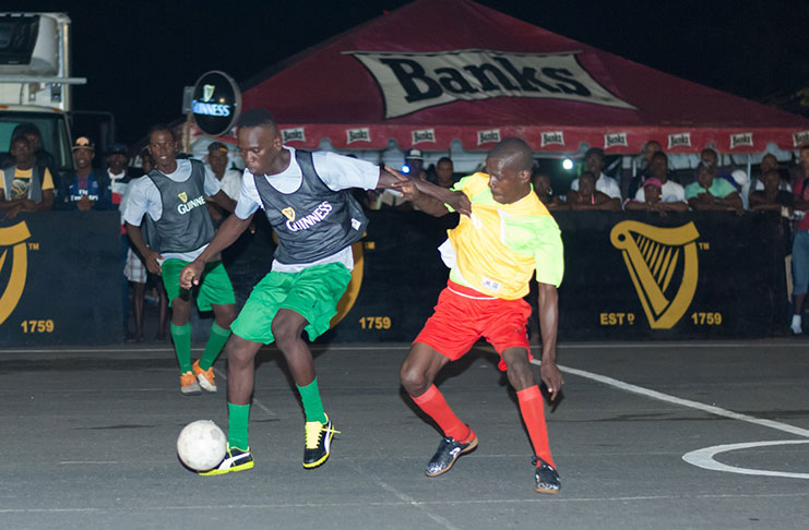 Part of the action during Tuesday evening’s Colors/Guinness Greatest of the Streets football tournament at Pouderoyen. (Delano Williams photo)