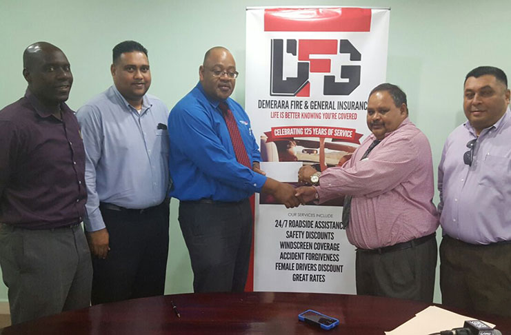 Demerara Mutual Life Assurance Society Limited Executive Marketing Manager Clarence Perry (third left) hands over the sponsorship cheque to GCB president Drubahadur in the presence of Colin Stuart (extreme left), GCB treasurer Anand Kalladeen (second left) and Marketing Manager Raj Singh.