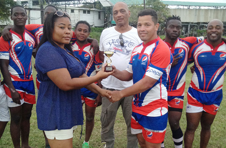 Pepsi Hornets captain and tournament MVP Ryan Gonzalves collects the winning trophy.