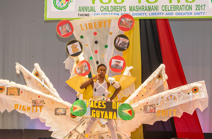 South Ruimveldt Secondary’s Rashidi Ceres showcasing 'Frolic Harmony' with faces of Guyana, designed by Quacy Welcome (Samuel Maughn photo)
