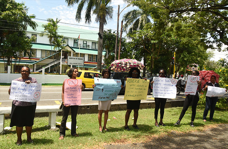 Red Threat protesting outside the Ministry of Finance. [Adrian Narine photo]