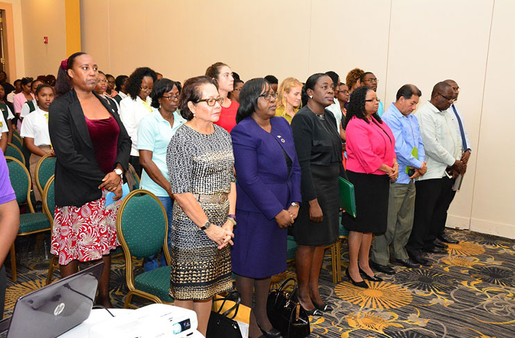 Observing a moment of silence at Friday’s launch for the late LaShay Johnson, former Peer Educator are, from left, first row: First Lady, Mrs Sandra Granger; Minister within the Ministry of Public Health, Dr Karen Cummings; Minister within the Ministry of Education, Ms Nicolette Henry; Minister of Public Health, Ms Volda Lawrence; and Minister of Indigenous People’s Affairs, Mr Sydney Allicock (Photos courtesy of the Ministry of the Presidency)