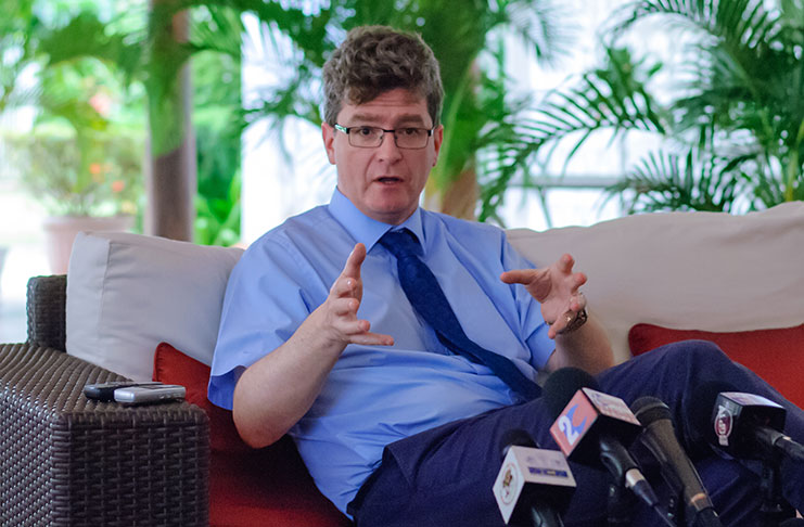 British High Commissioner, Greg Quinn, engaging reporters at his Bel Air Gardens residence on Tuesday [Delano Williams photo]