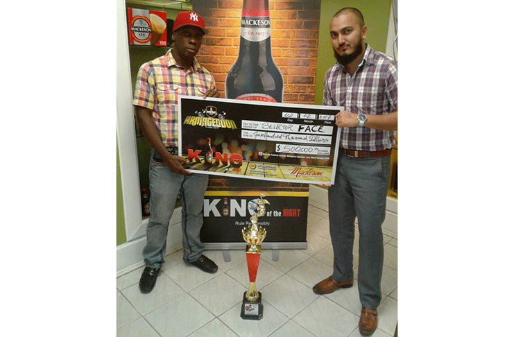 Selector Face (left) collecting his winnings from an Ansa McAl representative yesterday