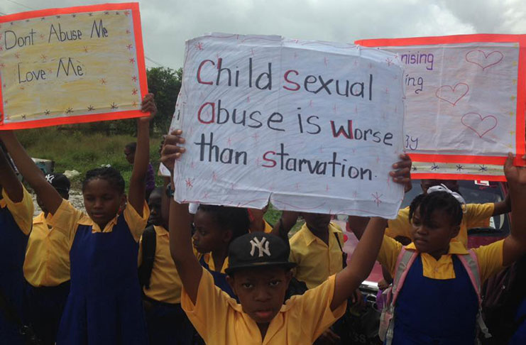 Children during the march against child abuse on Friday