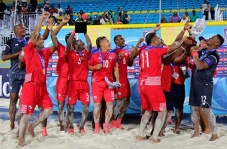Panama celebrate with the CONCACAF Beach Soccer Championship trophy.