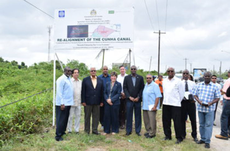 Minister of Agriculture, Noel Holder, and Minister of Public Infrastructure, David Patterson, with representatives of the Ministries of Agriculture and Finance and the World Bank at the recently unveiled project signboard, which outlines  details of the Cunha Canal Project