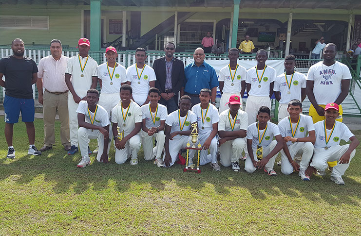 The victorious Berbice Combined team poses with the winning trophy. Also in photo are Director of Sport Christopher Jones, representative of the sponsor and executives of the Guyana Cricket Board.