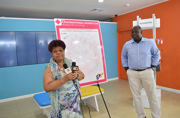 Minister of Social Protection, Amna Ally and GTT’s Chief Executive Officer, Justin Nedd, at the signing of the pledge at GTT’s Retail Experience Store, Brickdam, Georgetown
