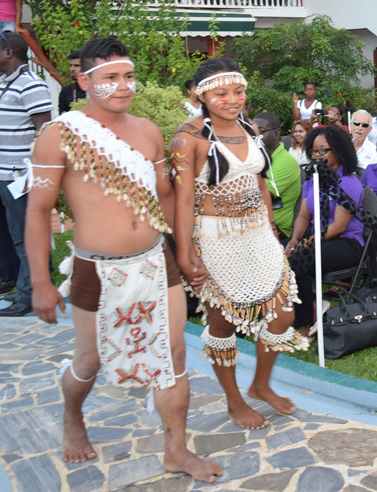 This couple of Amerindian heritage display their choice of traditional wedding apparel . Photos by Cullen Bess-Nelson