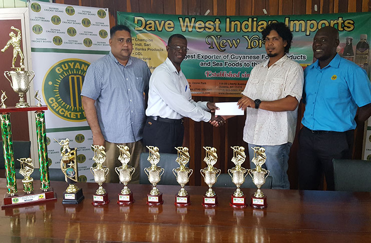 Dave West Indian Exports Guy-NY representative Cliff Joseph (second right) hands over the sponsorship cheque to GCB’s Chairman of Competitions Committee, Colin Europe. Colin Stuart (right) and GCB’s treasurer Anand Kalladeen share the moment.