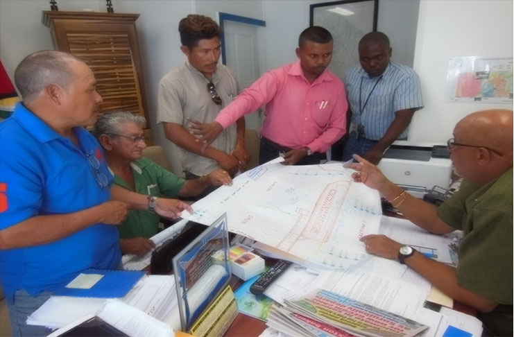Paramakatoi representatives discuss their proposal for a new water system with GWI officials