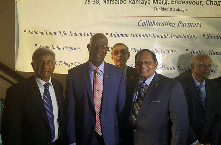 Prime Minister Moses Nagamootoo (front right) stands with Trinidad and Tobago’s Prime Minister, Keith Rowley (centre) and President of the Indian Diaspora Council, Ashook Ramsarran (front left) and other executives at the 100th anniversary celebration of the abolition of Indian Indentureship at the National Cultural Centre in Trinidad