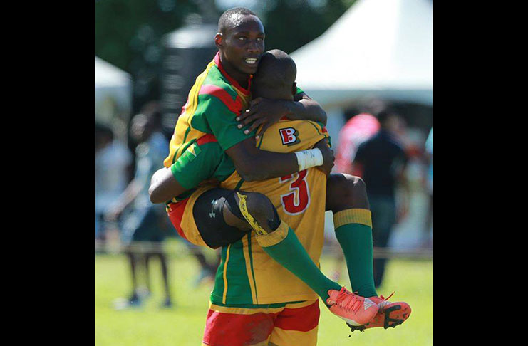 Patrick King celebrates in the arms of Dwayne Schroder (#3) after helping Guyana win  Rugby America's North (RAN) 7s Championship for a record eight times last year.