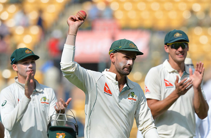 Nice Garry: Off-spinner  Nathan Lyon holds the ball aloft up claiming 8 for 50 on the first day  in Bengaluru.