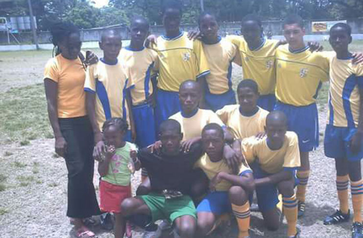 Roxanne Keith poses with some members of Pele FC’s youth team.