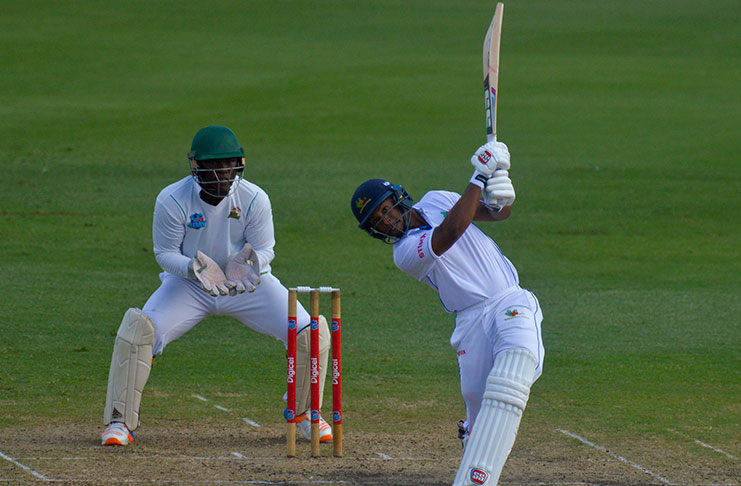 Shai Hope hits out during his unbeaten 118 on the opening day at Kensington Oval.