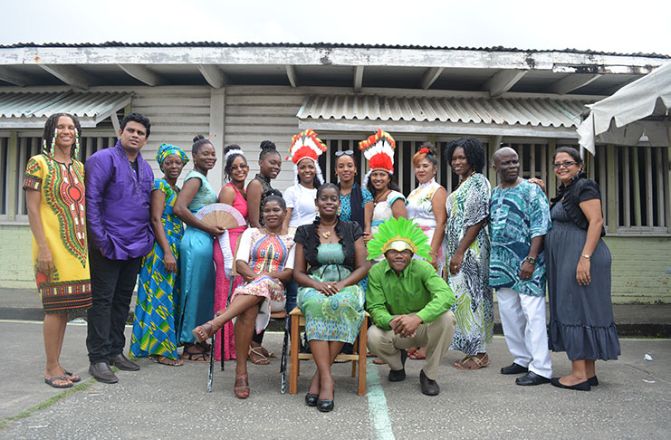 Acting HM, Michele Jordan (sitting right) and Deputy Headteacher, Dawn Monplaisir, with some of the other teachers of the school who helped make the Culture Day a success