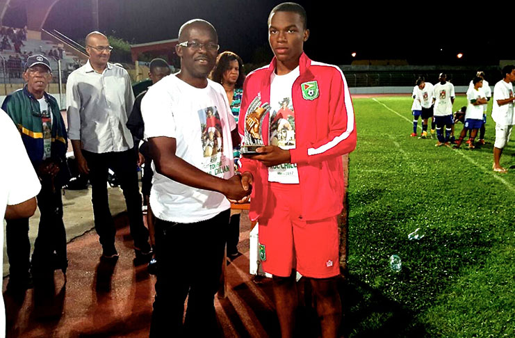 U.S -based Progressive Youths attacking midfielder Joshua Ferreira (U-17 captain) collecting the Fair Play Award at the Tournoi Paul Chillan in Martinique.