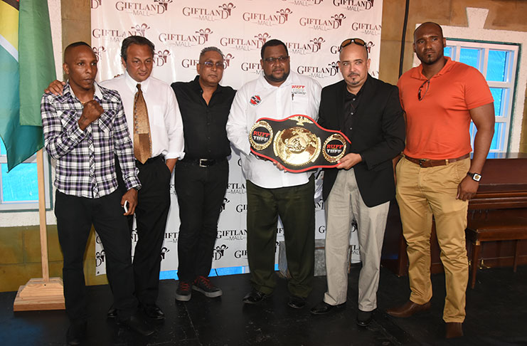 In this Adrian Narine photo, GBBC president Peter Abdool strikes a pose with from left, Dexter Marques, Giftland Mall CEO Royston Beepat, T&T MMA president Jason Fraser, Michael Singh and Gavin Singh.