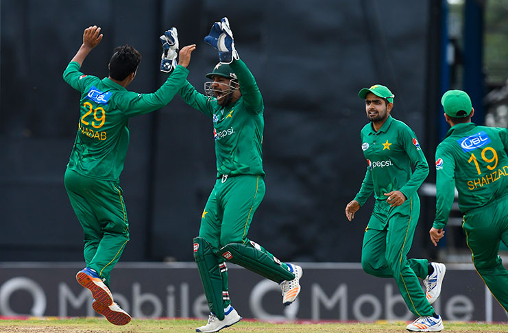 Shadab Khan celebrates with teammates during the 2nd T20I match between West Indies and Pakistan at Queen’s Park Oval, Port of Spain yesterday.