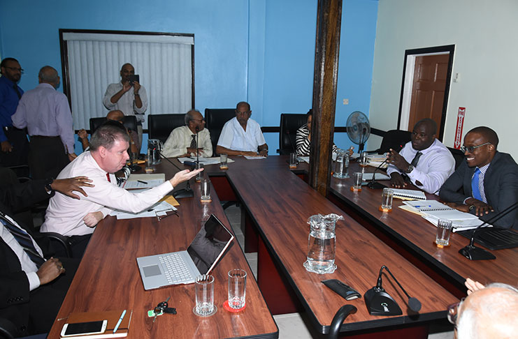 Digicel CEO Kevin Kelly (left) makes a point, while his GTT counterpart Justin Nedd counters at the Public Utilities Commission hearing on Tuesday