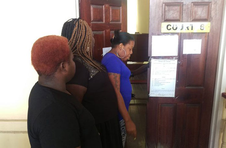 Petronella (in blue), stands at the door of Magistrate Bess’ court before the door was closed (DemeraraWaves Photo)