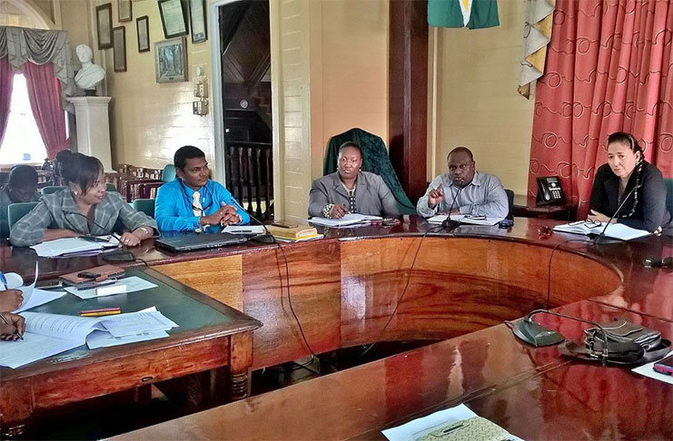 Town Clerk, Royston King, (second from right) responding to comments in the presence of Mayor Patricia Chase-Green (first from right), Solid Waste Director, Walter Narine and other officers