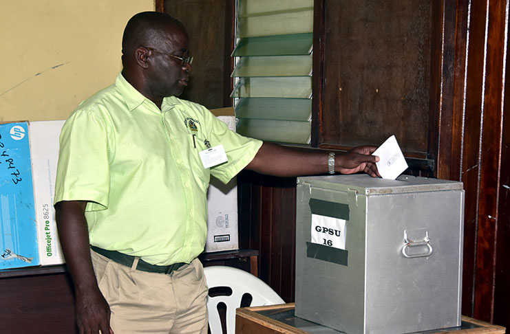 A voter casting his ballot at the GPSU building, Shiv Chanderpaul Drive, on Thursday