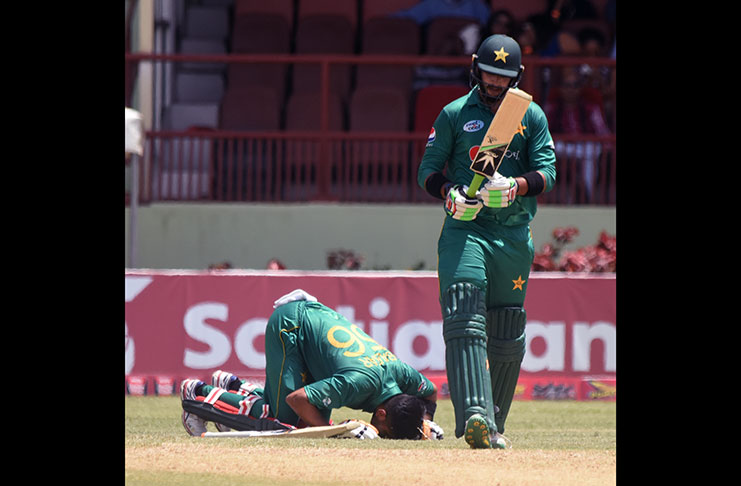 Babar Azam kisses the turf after reaching his fifth ODI hundred (Adrian Narine photo)