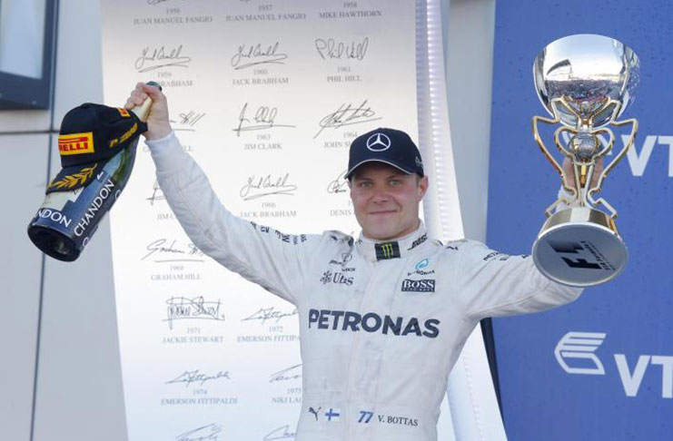 Mercedes Formula One driver Valtteri Bottas of Finland celebrates the victory on the podium. REUTERS/Maxim Shemetov