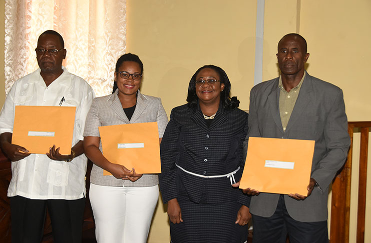 Chief Magistrate Ann McLennan flanked by the chairman and members of the CoI. From left to right: Assistant Commissioner of Police (retired) Winston Cosbert, Christine Bailey, Chief Magistrate Ann McLennan and chairman of the CoI,  Brigadier (retired) Bruce Lovell