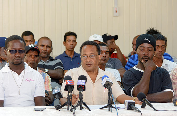 GAWU, General-Secretary, Seepaul Narine  (second left ), sits alongside the affected sugar-cane planters