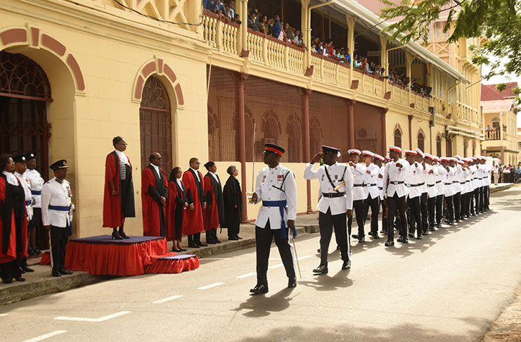 Acting Chief Justice, Ms. Roxane George-Wiltshire taking the salute from the ceremonial Guard of Honour