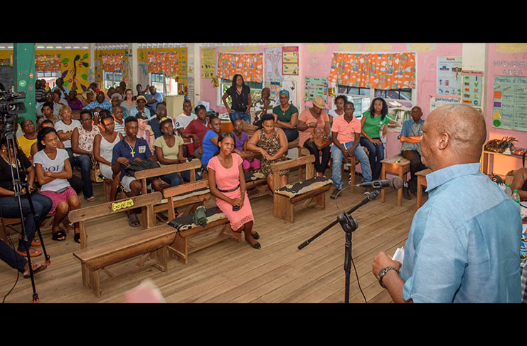 Minister of State, Joseph Harmon, addressing residents at the Den Amstel Primary School (Photos by Samuel Maughn)