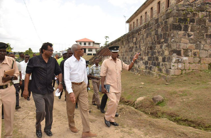 President David Granger and Public Security Minister, Khemraj Ramjattan and prison officials during their tour of the Mazaruni Penal Settlement last year (File Photo)
