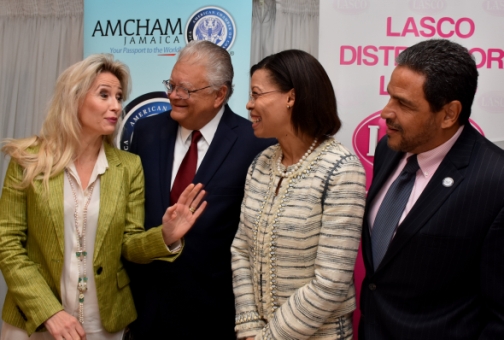 Minister of Industry, Commerce, Agriculture and Fisheries, Karl Samuda (second left), with (from left) Managing Director, AMCHAM Finland, Dr Erica Sauer; Country Managing Partner, Ernst and Young (EY), Allison Peart; and Private Sector Co-Chair, Overseas Security Advisory Council (OSAC) Jamaica, Derrick Nembhard, during an AMCHAM Breakfast Forum at The Jamaica Pegasus hotel on March 31. (Photo: JIS)