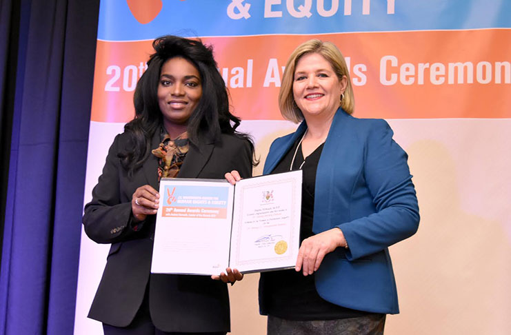 Dr Dionne Duncan (left) receives the Women of Distinction award from NDP leader Andrea Horwath.