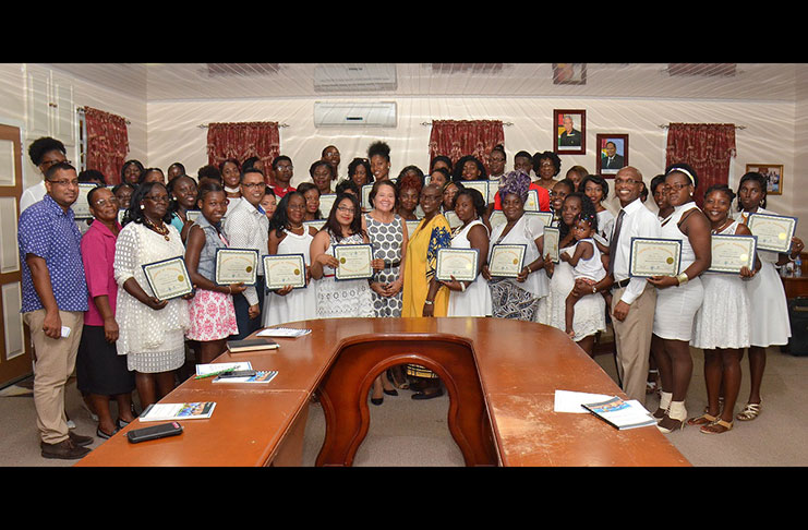 First Lady Mrs. Sandra Granger is flanked by successful participants of the Self-Reliance and Success in Business workshop, Deputy Regional executive officer of Region-Five, Regional Officials and Facilitators of Interweave Solutions Incorporated