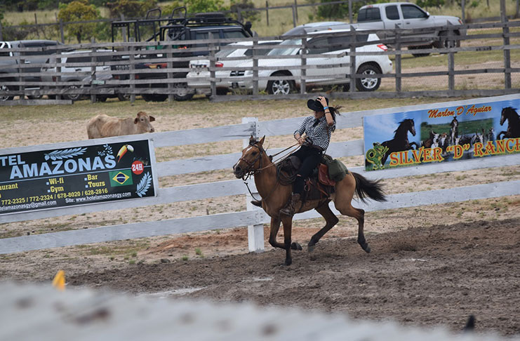 A young cowgirl showing the audience her horse-riding skills in the ring
at the Rupununi Rodeo on Saturday (Ministry of the Presidency photo)
