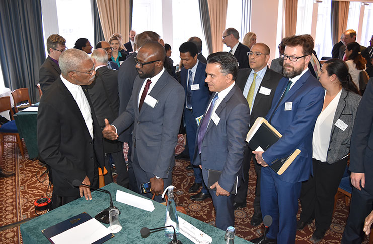 UK investors queued up to speak one-on-one with President David Granger, following the formal presentations. Here the Head of State is pictured in discussion
with Director at ION Geophysical, Mr. Folarin Lajumoke.( Ministry of the Presidency photo)