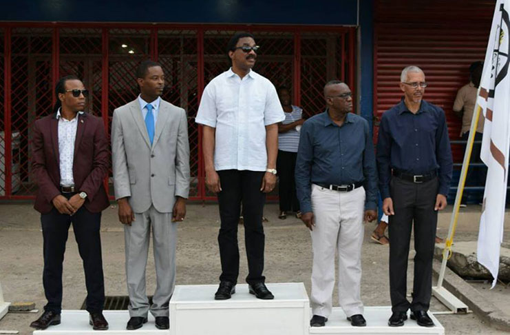 Minister of Legal Affairs and Attorney General, Basil Williams, (Center) Regional Chairman, Renis Morian and Minister of Business, Dominic Gaskin, (right) Member of Parliament, Jermaine Figueira and Mayor of Linden, Carwyn Holland (left) awaiting the March Pass