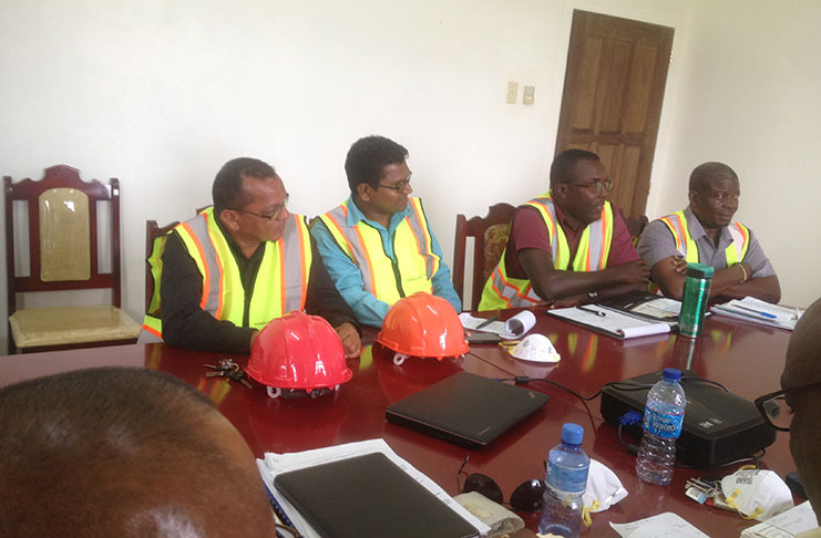 Officials from Puran Brothers Disposal Inc during discussions with officials of the Ministry of Communitie